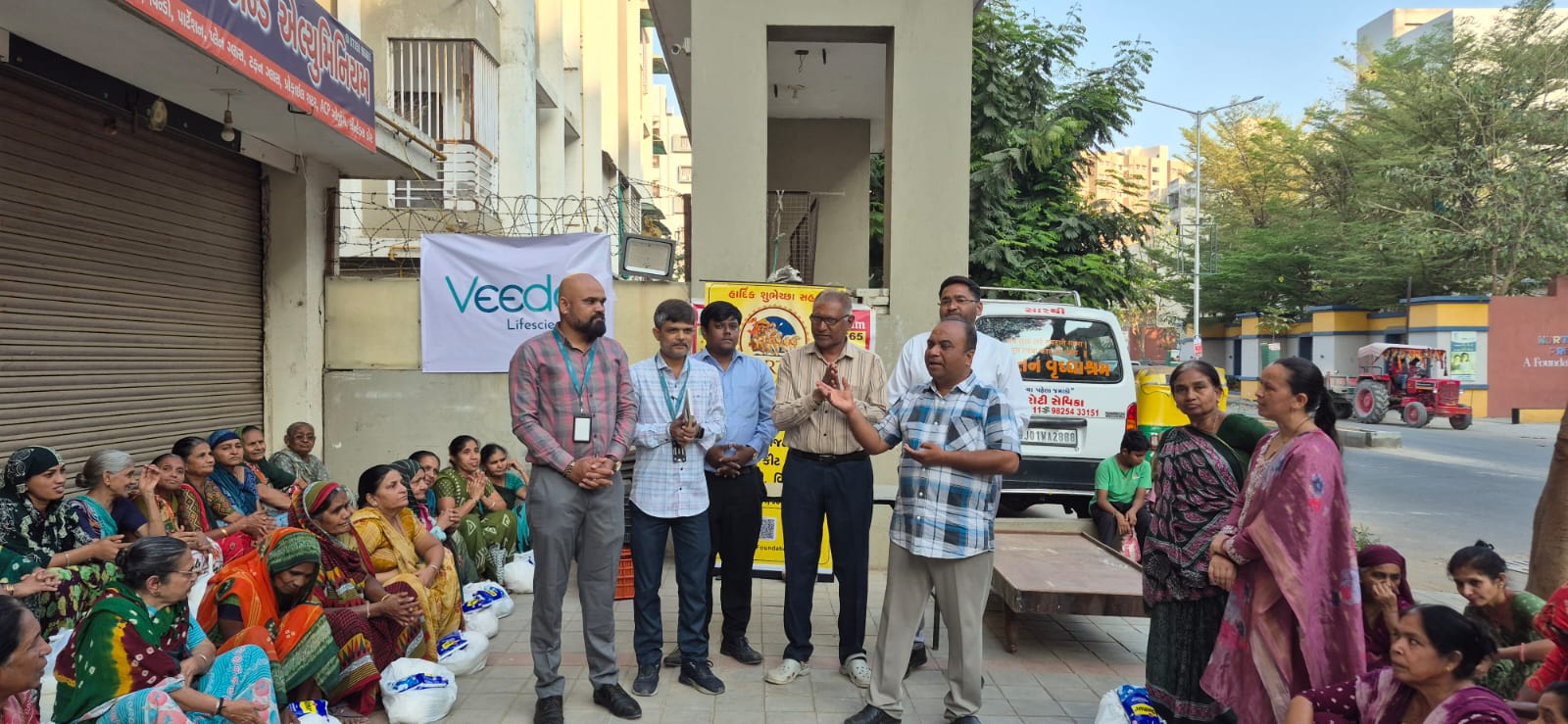 Veeda Lifesciences CSR grocery distribution event for widows Ahmedabad